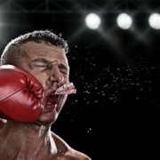 Anaxco IT-Sicherheit Teaserbild Mann bekommt Schlag ins Gesicht Cybersecurity IT-Sicherheit Datensicherheit Cyberkriminalität Cloud Hackerangriff